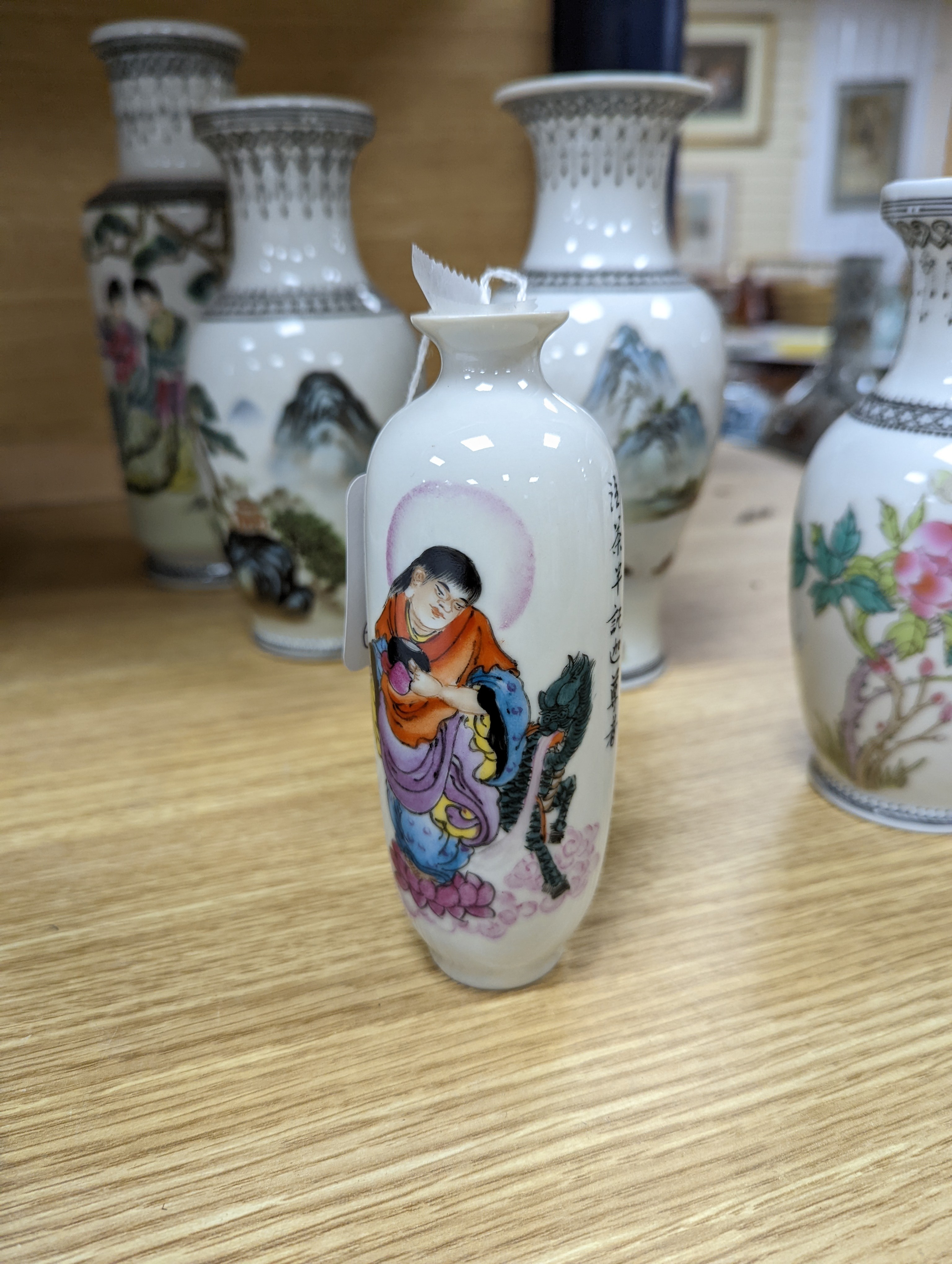 A group of seven Chinese famille rose vases, 20th century